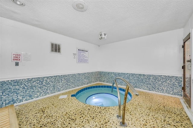 230 Medallion Blvd Unit G, Madeira Beach, FL 33708 - detailed view of a textured ceiling and wainscoting