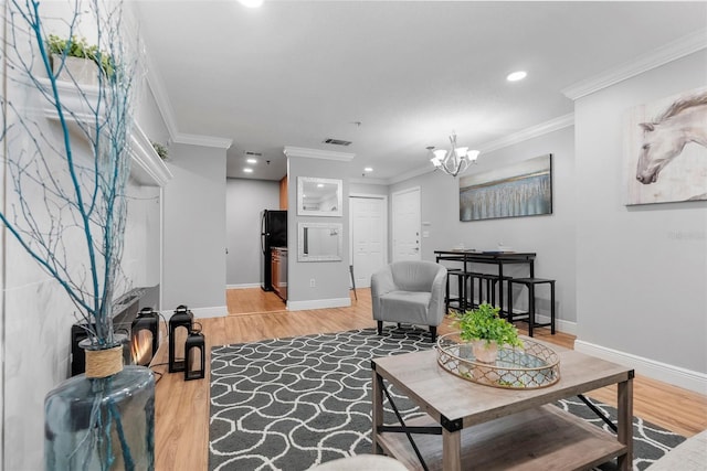 11901 4th St N Unit 8207, Saint Petersburg, FL 33716 - living room featuring light wood-style floors, a chandelier, recessed lighting, baseboards, and ornamental molding