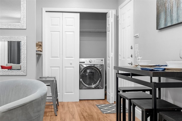 11901 4th St N Unit 8207, Saint Petersburg, FL 33716 - laundry room featuring washer / dryer and light wood-style floors