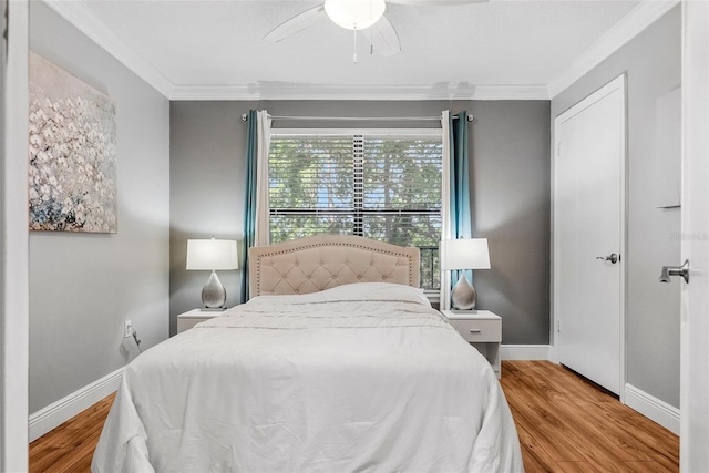 11901 4th St N Unit 8207, Saint Petersburg, FL 33716 - bedroom featuring ornamental molding, wood finished floors, baseboards, and a ceiling fan