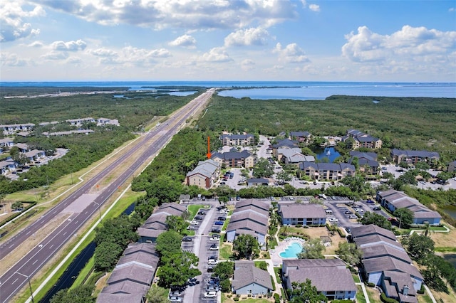 11901 4th St N Unit 8207, Saint Petersburg, FL 33716 - aerial perspective of suburban area featuring a main thoroughfare, a nearby body of water, and a pool