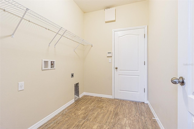 laundry area with washer hookup, baseboards, and electric dryer hookup