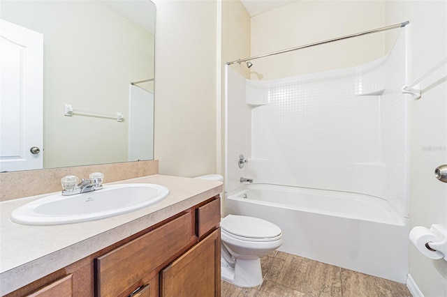 full bathroom with toilet, shower / bathtub combination, vanity, and wood finished floors
