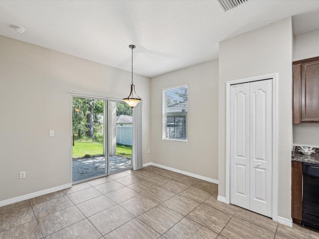 12212 Mcmullen Loop, Riverview, FL 33569 - unfurnished dining area featuring baseboards and light tile patterned flooring