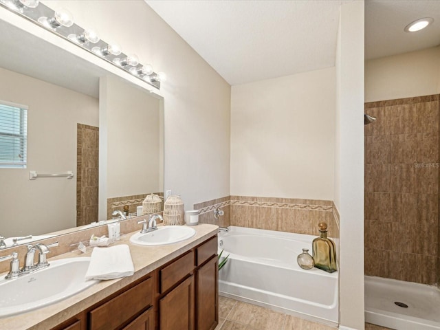 12212 Mcmullen Loop, Riverview, FL 33569 - bathroom featuring a bath, double vanity, and tiled shower