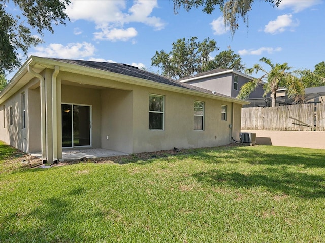 12212 Mcmullen Loop, Riverview, FL 33569 - back of property featuring stucco siding, central air condition unit, and a patio