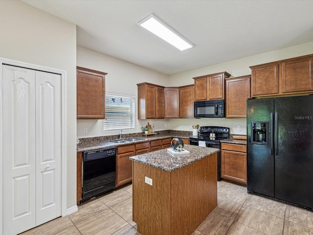 12212 Mcmullen Loop, Riverview, FL 33569 - kitchen featuring black appliances, a kitchen island, dark stone counters, a sink, and brown cabinetry