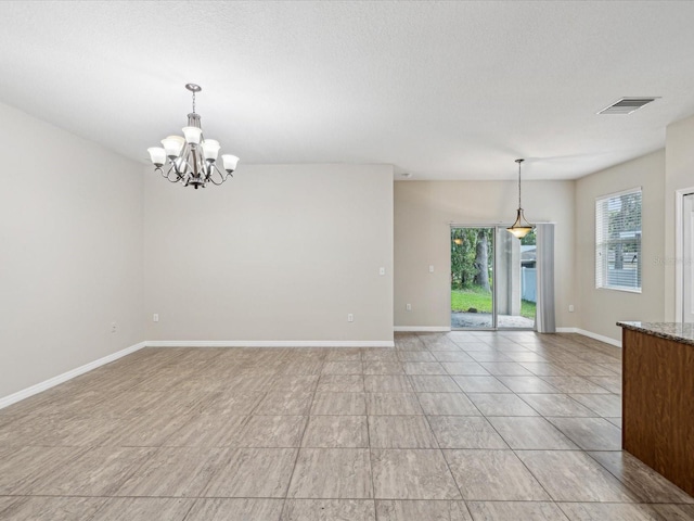12212 Mcmullen Loop, Riverview, FL 33569 - empty room featuring a chandelier and baseboards
