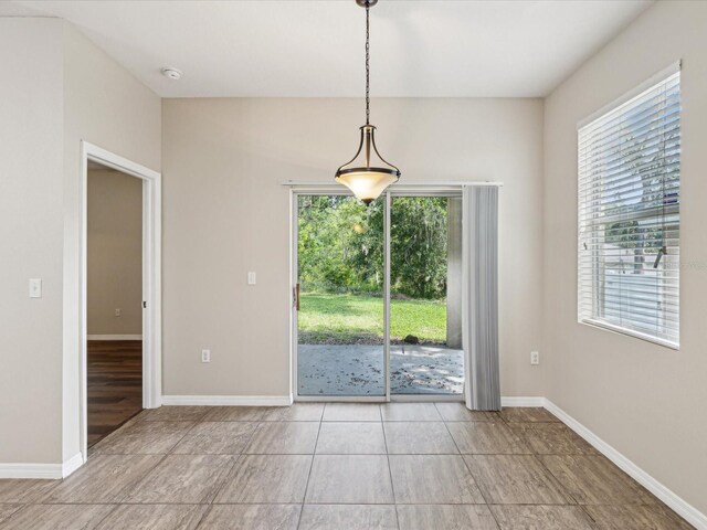 12212 Mcmullen Loop, Riverview, FL 33569 - unfurnished dining area featuring baseboards
