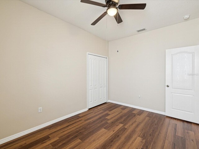 12212 Mcmullen Loop, Riverview, FL 33569 - spare room with dark wood-style floors, ceiling fan, baseboards, and a smoke detector