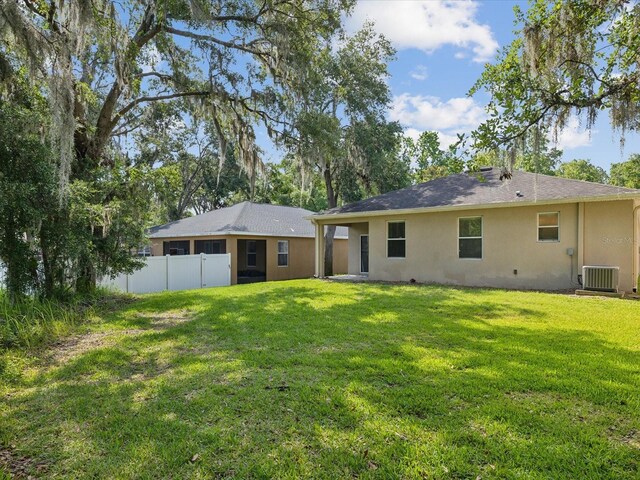 12212 Mcmullen Loop, Riverview, FL 33569 - rear view of house featuring central AC and stucco siding