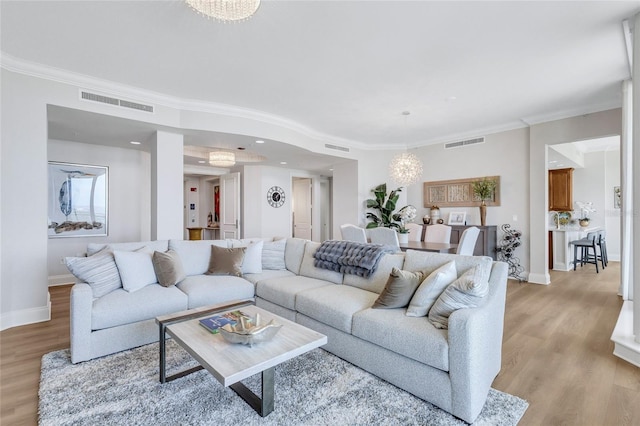 140 Riviera Dunes Way Unit 1203, Palmetto, FL 34221 - living area featuring light wood finished floors, baseboards, crown molding, a chandelier, and recessed lighting