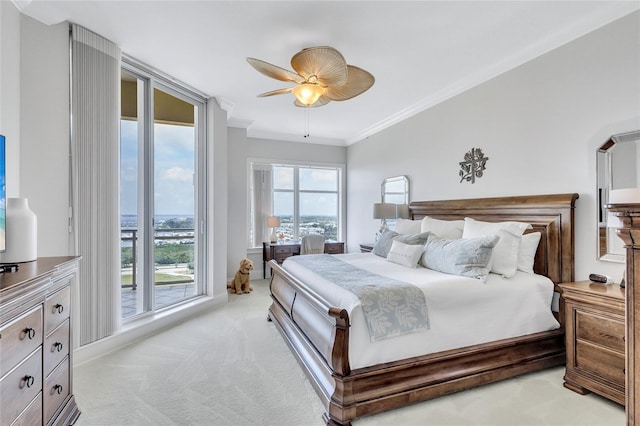 140 Riviera Dunes Way Unit 1203, Palmetto, FL 34221 - bedroom featuring light carpet, crown molding, a ceiling fan, and baseboards