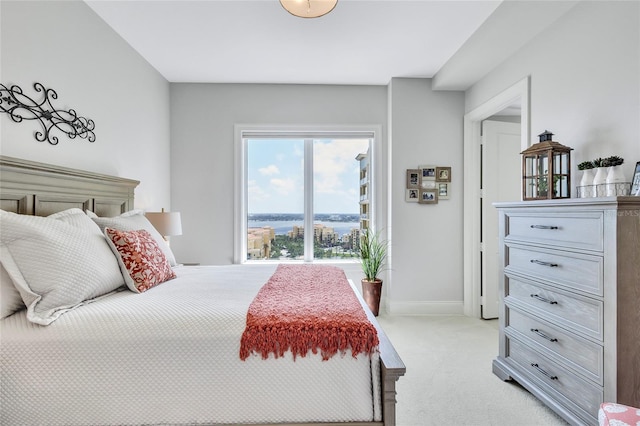 140 Riviera Dunes Way Unit 1203, Palmetto, FL 34221 - bedroom featuring light carpet and baseboards