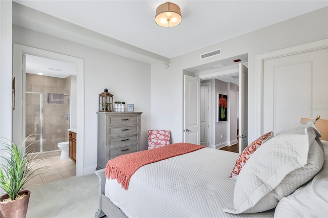 140 Riviera Dunes Way Unit 1203, Palmetto, FL 34221 - bedroom featuring ensuite bath and baseboards