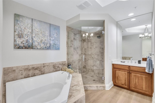 140 Riviera Dunes Way Unit 1203, Palmetto, FL 34221 - bathroom with a chandelier, a bath, a shower stall, vanity, and recessed lighting