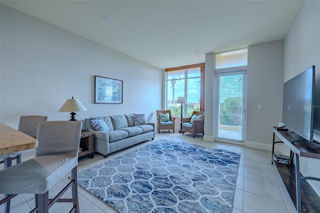 140 Riviera Dunes Way Unit 1203, Palmetto, FL 34221 - living room with light tile patterned floors and baseboards