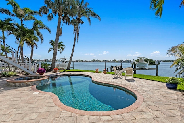 443 18th Ave, Indian Rocks Beach, FL 33785 - view of pool with boat lift, a patio, a pool with connected hot tub, a boat dock, and a water view