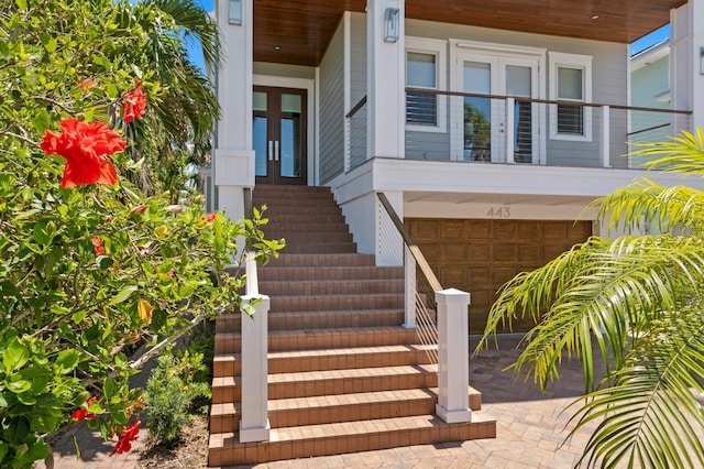 443 18th Ave, Indian Rocks Beach, FL 33785 - property entrance with a garage and french doors