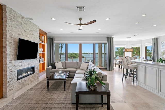 443 18th Ave, Indian Rocks Beach, FL 33785 - living area with plenty of natural light, ornamental molding, a ceiling fan, a fireplace, and recessed lighting