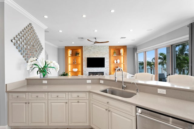 443 18th Ave, Indian Rocks Beach, FL 33785 - kitchen with a sink, stainless steel dishwasher, built in shelves, a stone fireplace, and recessed lighting