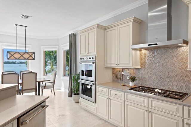 443 18th Ave, Indian Rocks Beach, FL 33785 - kitchen with wall chimney exhaust hood, stainless steel appliances, tasteful backsplash, light countertops, and crown molding