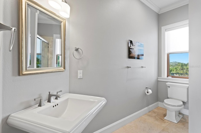 443 18th Ave, Indian Rocks Beach, FL 33785 - full bathroom featuring crown molding, toilet, a sink, a stall shower, and baseboards