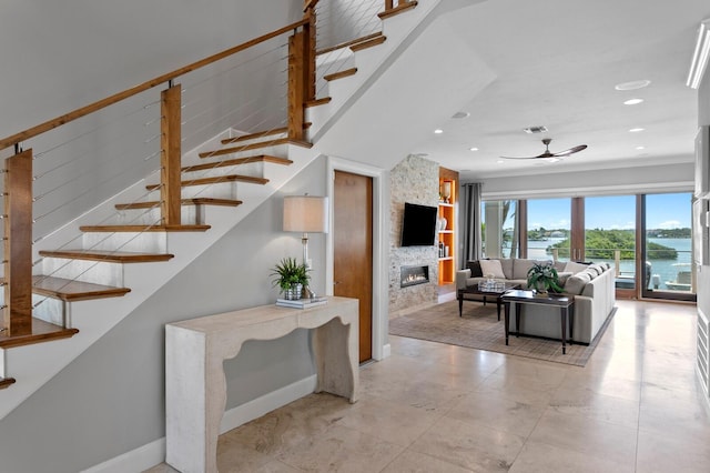 443 18th Ave, Indian Rocks Beach, FL 33785 - living room with a ceiling fan, stairs, a fireplace, recessed lighting, and baseboards