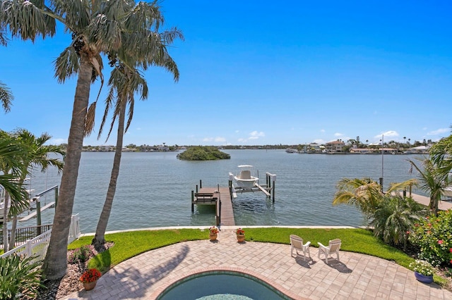 443 18th Ave, Indian Rocks Beach, FL 33785 - dock area with boat lift, a water view, a patio, and a hot tub