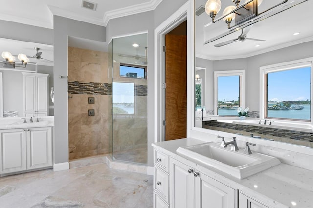 443 18th Ave, Indian Rocks Beach, FL 33785 - bathroom with ceiling fan, two vanities, a shower stall, ornamental molding, and a chandelier