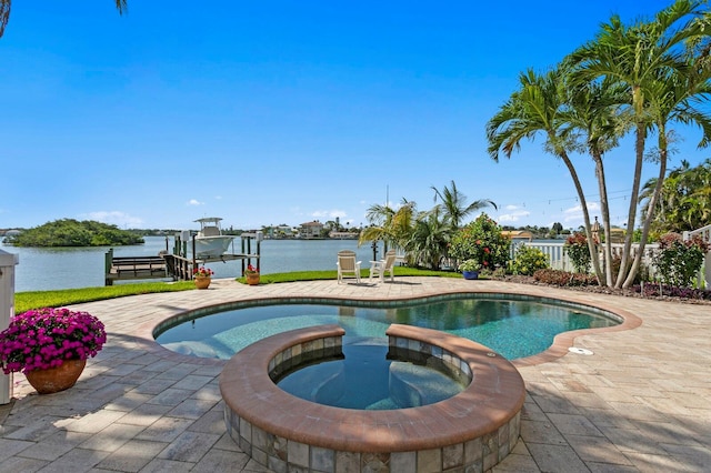 443 18th Ave, Indian Rocks Beach, FL 33785 - view of pool with boat lift, a dock, a water view, and a pool with connected hot tub
