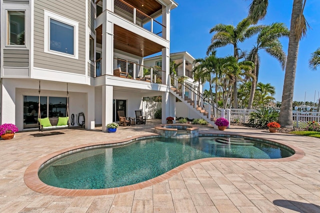 443 18th Ave, Indian Rocks Beach, FL 33785 - view of pool featuring a patio, a pool with connected hot tub, and stairway
