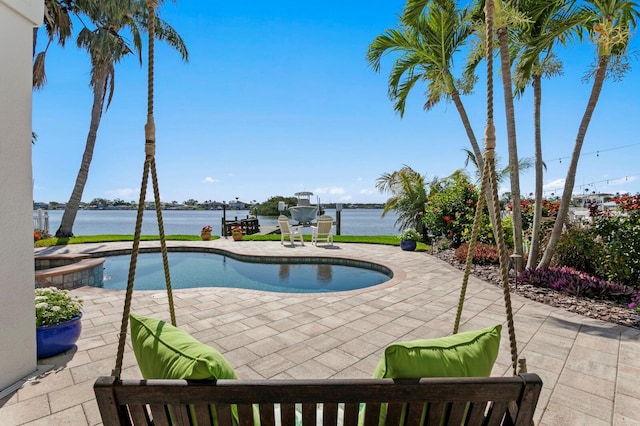 443 18th Ave, Indian Rocks Beach, FL 33785 - view of swimming pool with a patio area, a pool with connected hot tub, and a water view