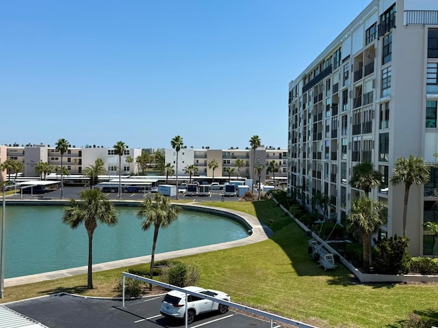7910 Sun Island Dr S Unit 404, South Pasadena, FL 33707 - view of pool with a lawn, a residential view, and a water view