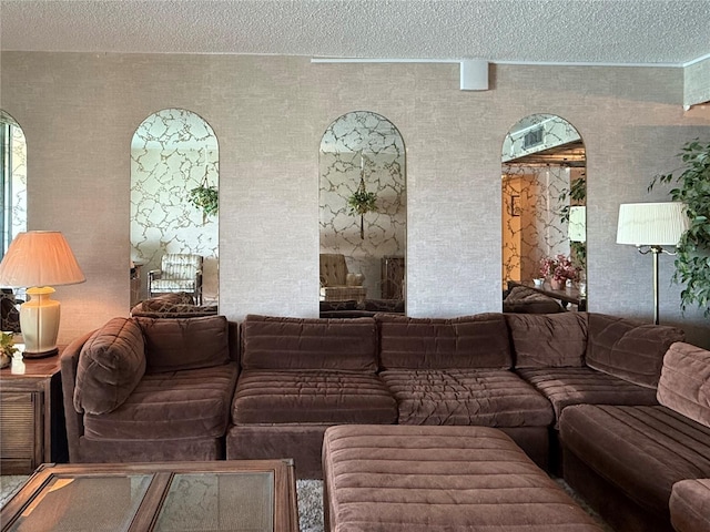 7910 Sun Island Dr S Unit 404, South Pasadena, FL 33707 - living room with a textured ceiling and arched walkways