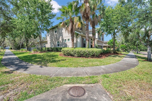 5117 Longspur Ct, Lithia, FL 33547 - view of side of home featuring stucco siding and a yard