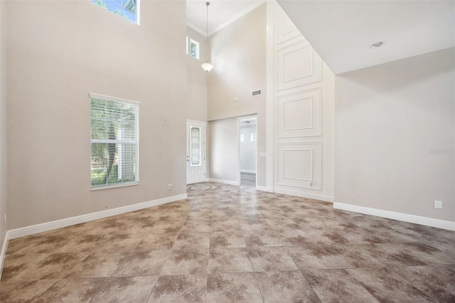 5117 Longspur Ct, Lithia, FL 33547 - unfurnished living room with baseboards and a high ceiling