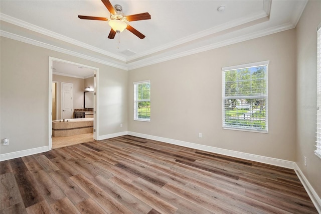 5117 Longspur Ct, Lithia, FL 33547 - spare room featuring wood finished floors, baseboards, ceiling fan, ornamental molding, and a smoke detector
