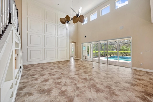 5117 Longspur Ct, Lithia, FL 33547 - unfurnished living room with a high ceiling and baseboards