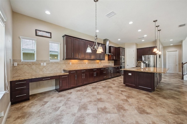 5117 Longspur Ct, Lithia, FL 33547 - kitchen with appliances with stainless steel finishes, dark brown cabinets, decorative backsplash, light stone countertops, and recessed lighting