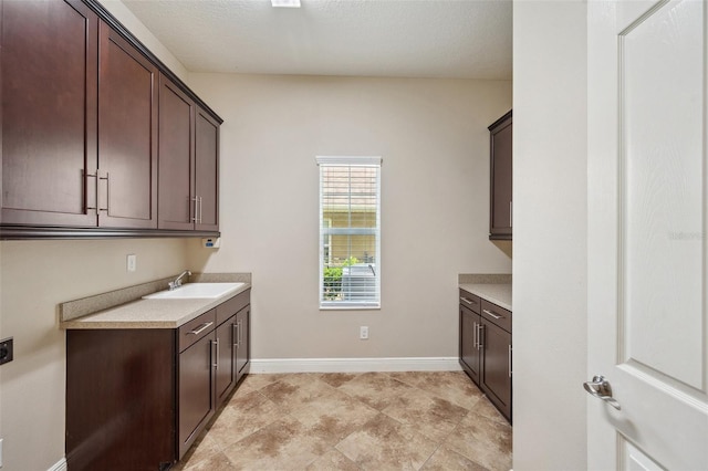 5117 Longspur Ct, Lithia, FL 33547 - laundry room featuring baseboards