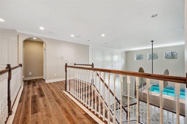 5117 Longspur Ct, Lithia, FL 33547 - hallway featuring an upstairs landing, recessed lighting, light wood-type flooring, arched walkways, and baseboards