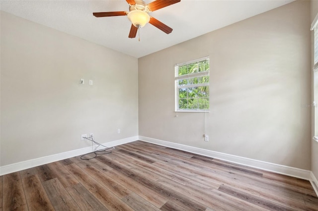 5117 Longspur Ct, Lithia, FL 33547 - unfurnished room with baseboards, wood finished floors, and a ceiling fan