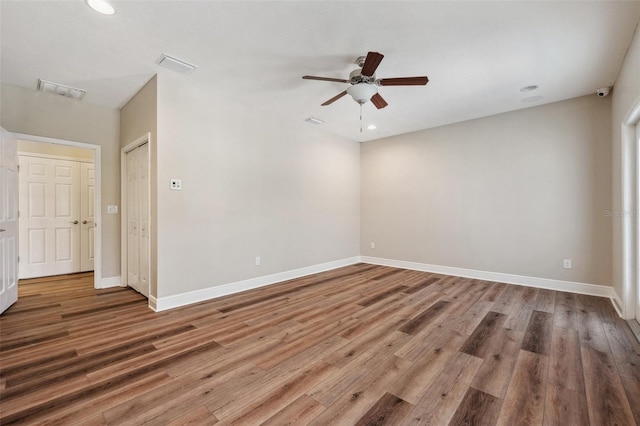 5117 Longspur Ct, Lithia, FL 33547 - empty room with ceiling fan, wood finished floors, baseboards, and recessed lighting