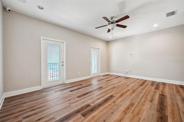 5117 Longspur Ct, Lithia, FL 33547 - empty room featuring light wood-style floors, a ceiling fan, baseboards, and recessed lighting
