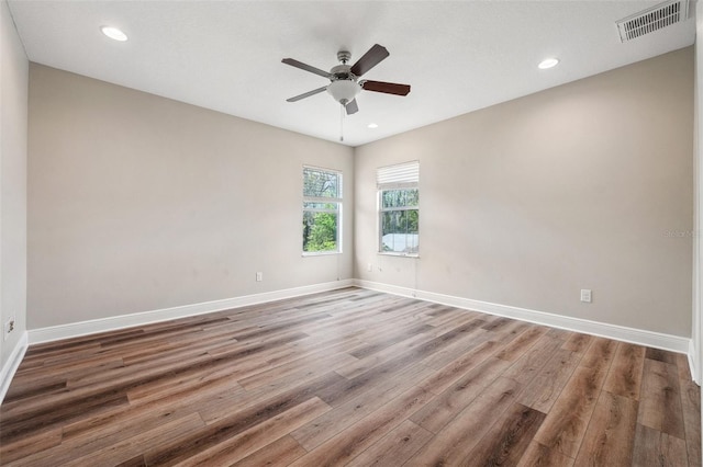 5117 Longspur Ct, Lithia, FL 33547 - unfurnished room featuring wood finished floors, ceiling fan, baseboards, and recessed lighting