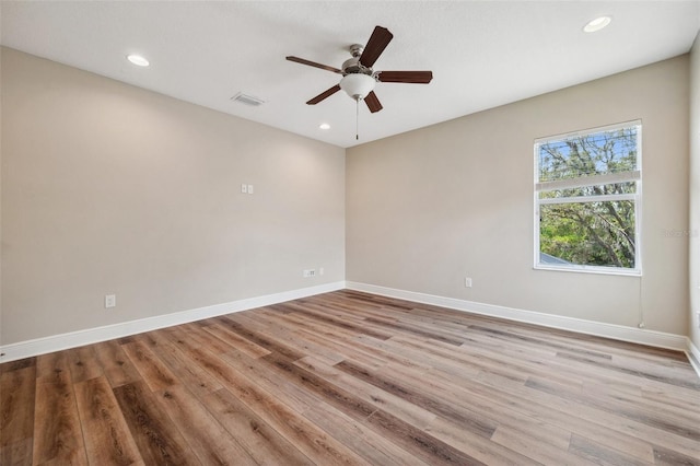 5117 Longspur Ct, Lithia, FL 33547 - empty room with wood finished floors, a ceiling fan, baseboards, and recessed lighting