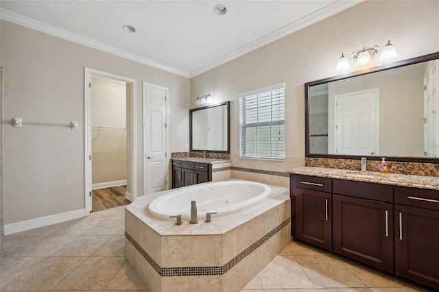 5117 Longspur Ct, Lithia, FL 33547 - bathroom featuring ornamental molding, a bath, tile patterned floors, two vanities, and a walk in closet