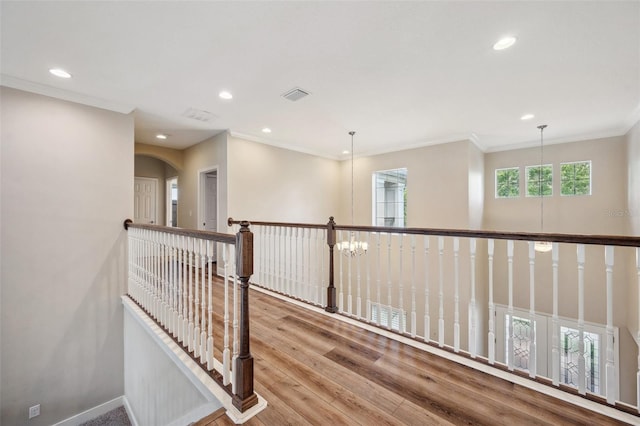 5117 Longspur Ct, Lithia, FL 33547 - hallway with recessed lighting, wood finished floors, crown molding, an upstairs landing, and baseboards