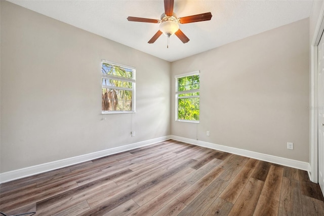 5117 Longspur Ct, Lithia, FL 33547 - unfurnished room with wood finished floors, baseboards, and ceiling fan
